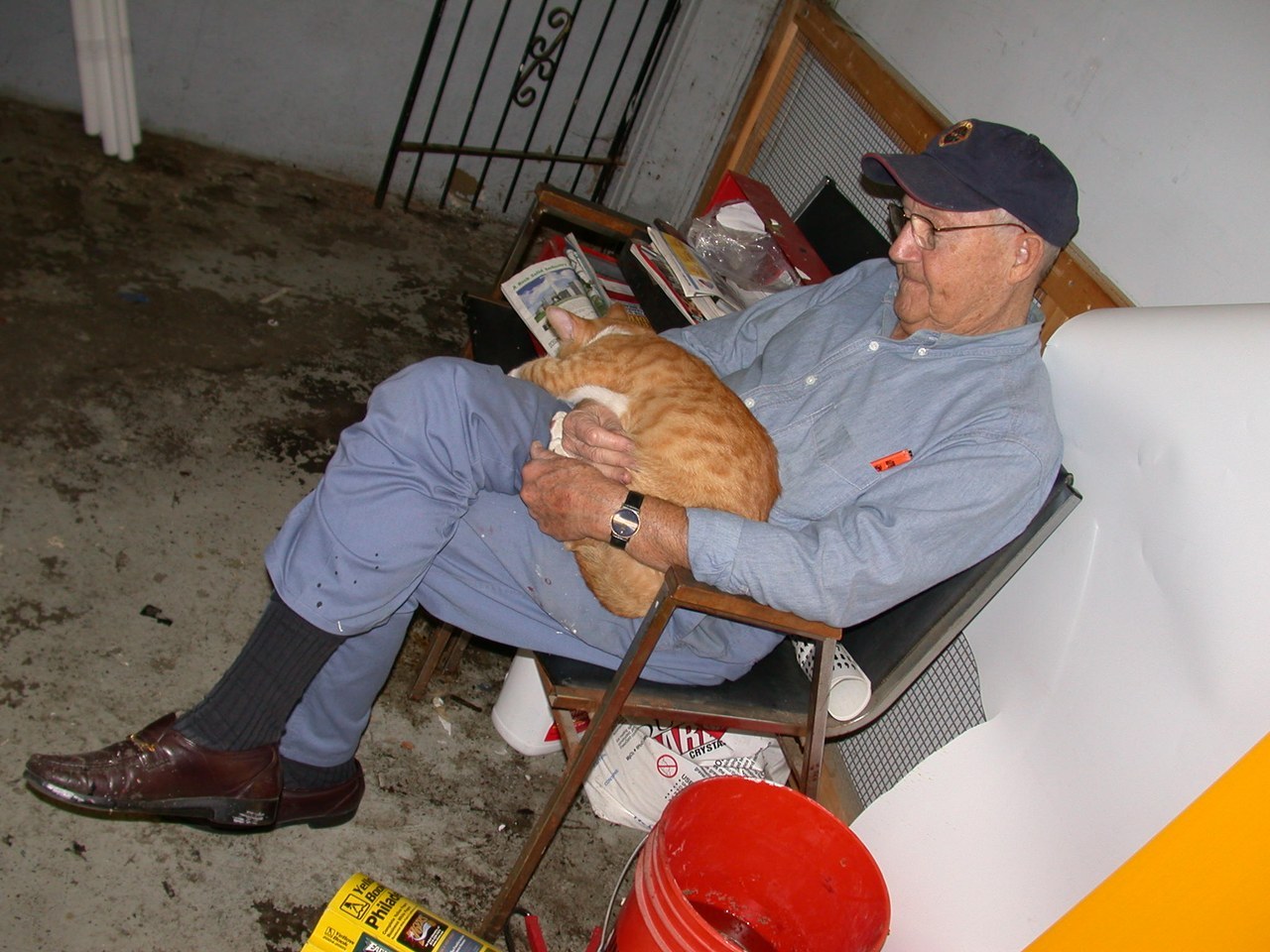 Joe Bauder Sr With Choo Choo In Shop Chair