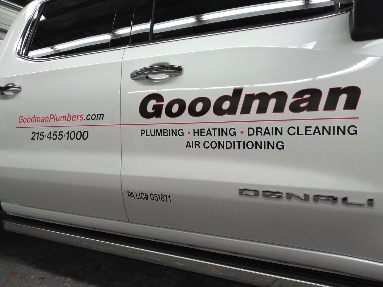Goodman Plumbing Heating Drain Cleaning GMC Denali Door
