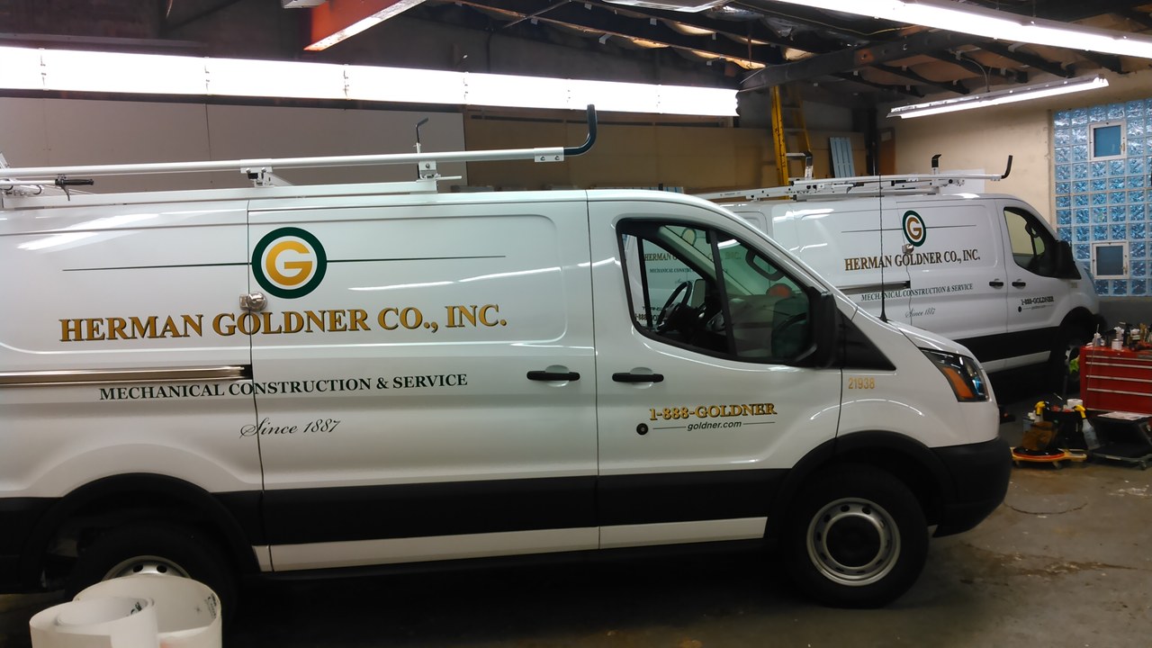 Herman Goldner Co Inc Two Transit Vans In Shop