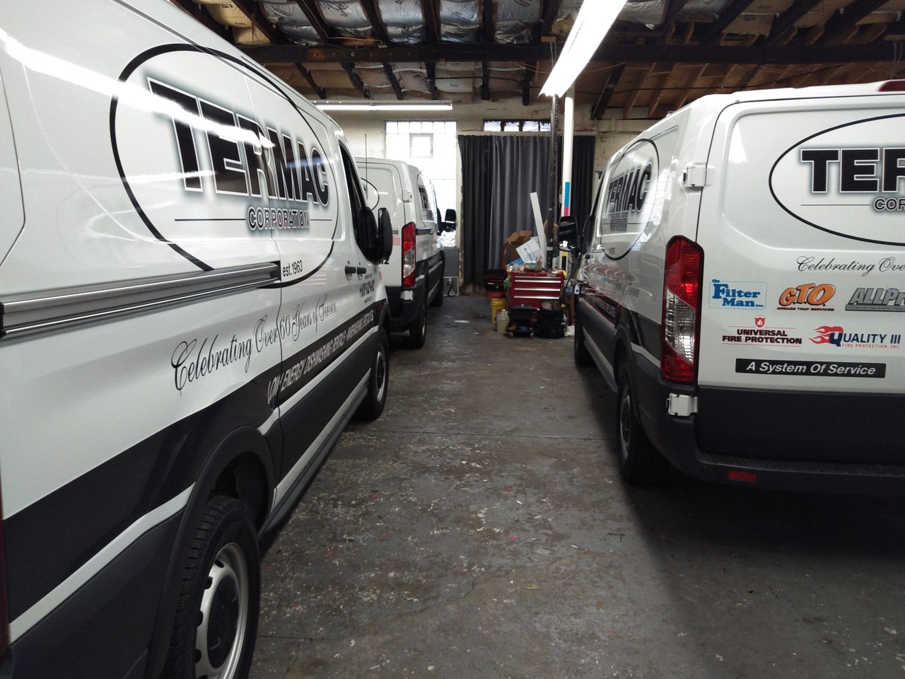 Termac Corporation Two Ford Transit Vans In Shop