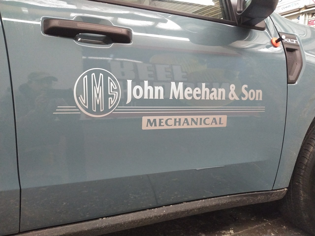 John Meehan And Son Mechanical Truck Door