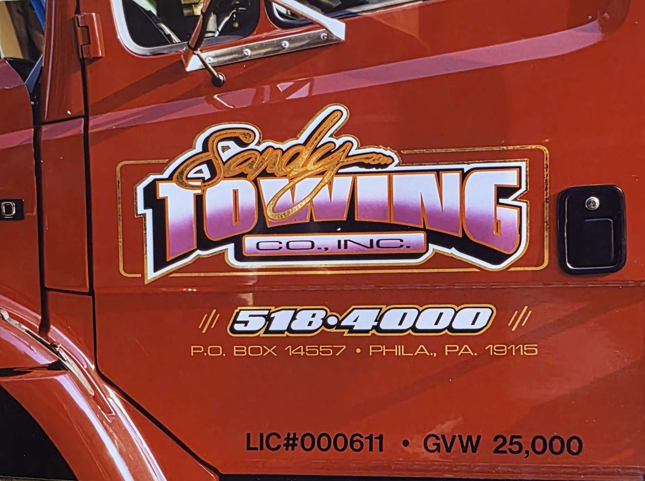 sandy towing co truck door